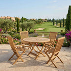 Wooden outdoor dining set with chairs and a table on a patio with a scenic background.