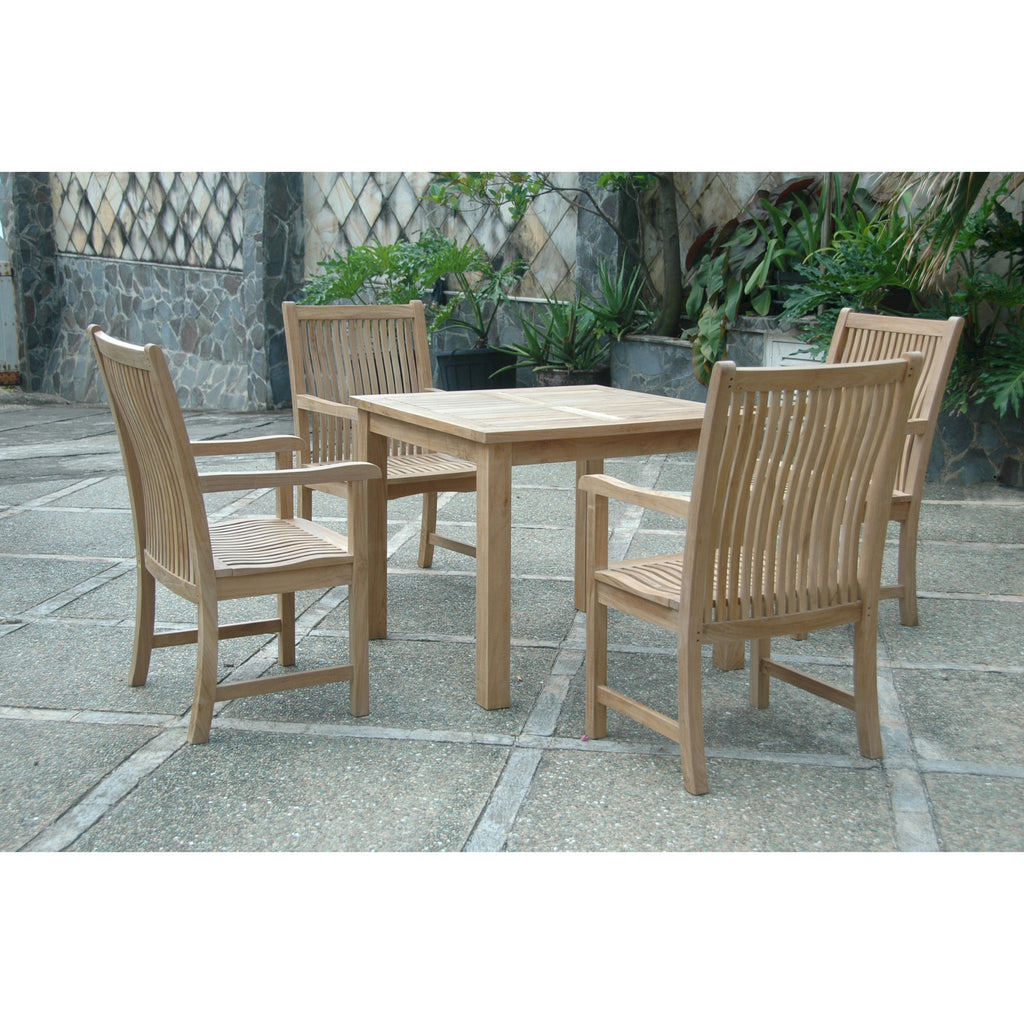 A 5-piece outdoor teak dining set including a square table and four armchairs, shown on a stone patio with potted plants in the background.