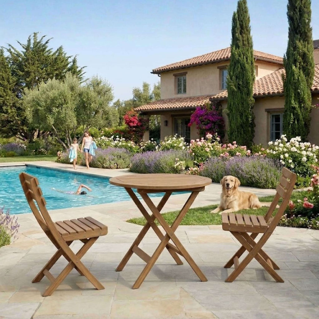 Wooden outdoor table and chairs on a patio with a pool and house in the background