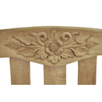 Wooden headboard with floral carvings on a white background