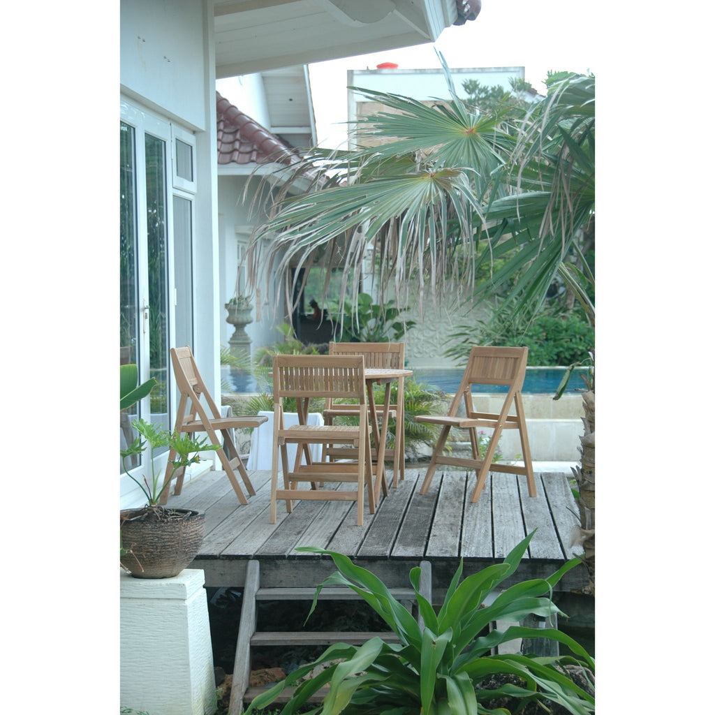 Outdoor patio with wooden furniture and plants on a wooden deck.
