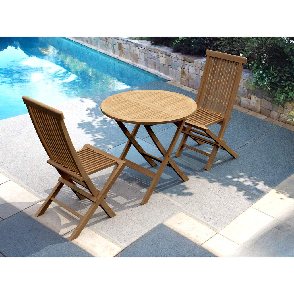 A 3-piece outdoor patio bistro set consisting of a round slatted table and two folding chairs, made of natural brown wood, shown on a stone patio next to a swimming pool.