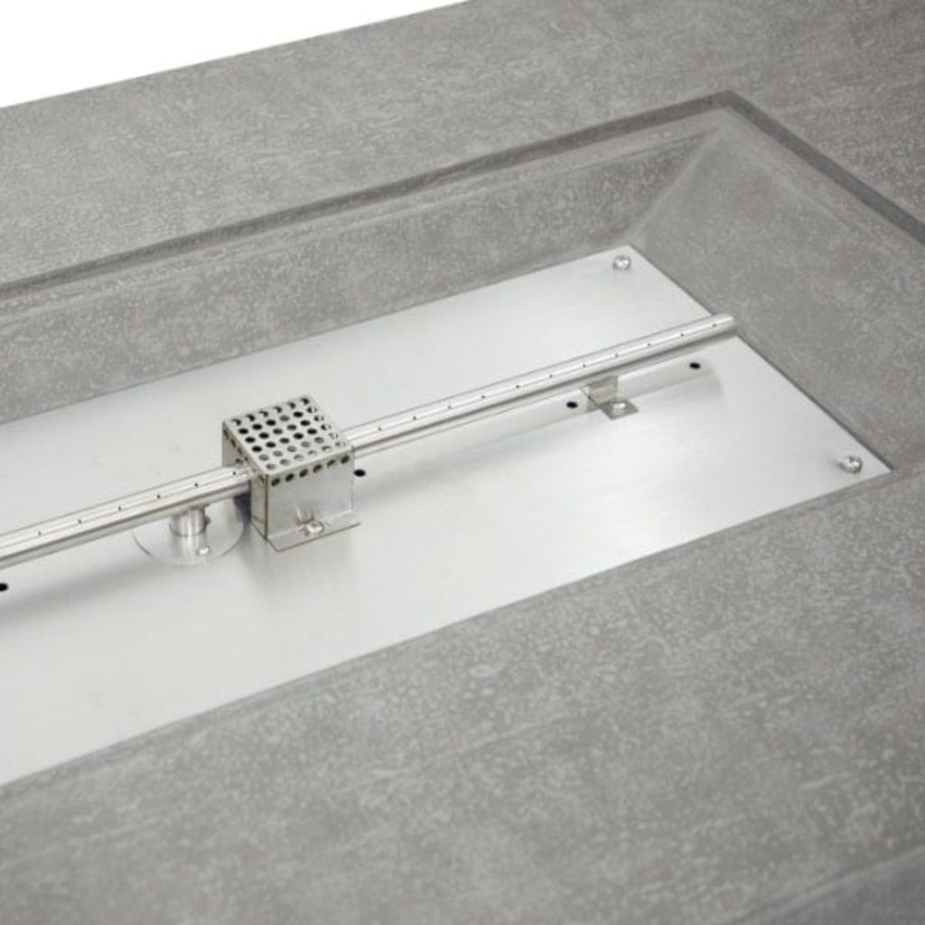 A stainless steel linear guide rail assembly with a central perforated metal block and mounting brackets, set into a gray textured surface.
