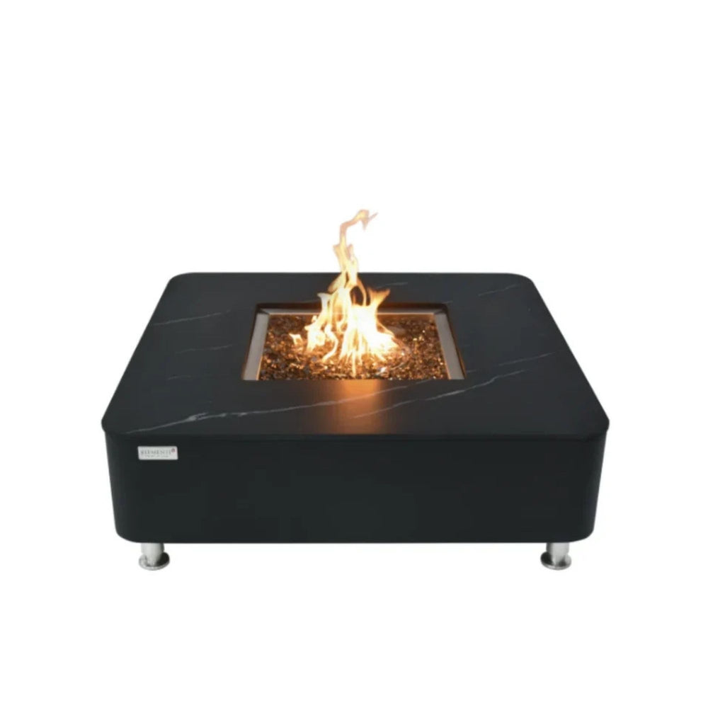 A square black outdoor fire pit table with a visible flame, set against a plain white background.