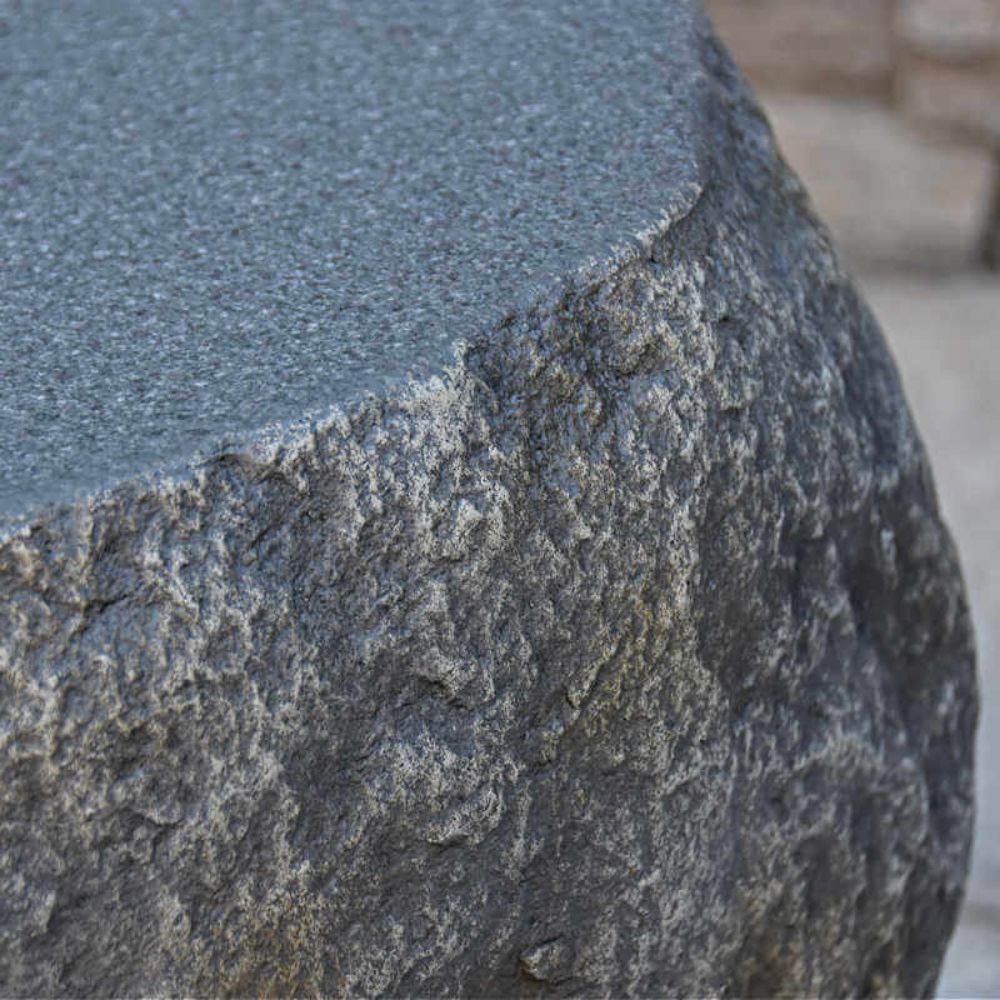 Close-up of a textured stone surface with a blurred background