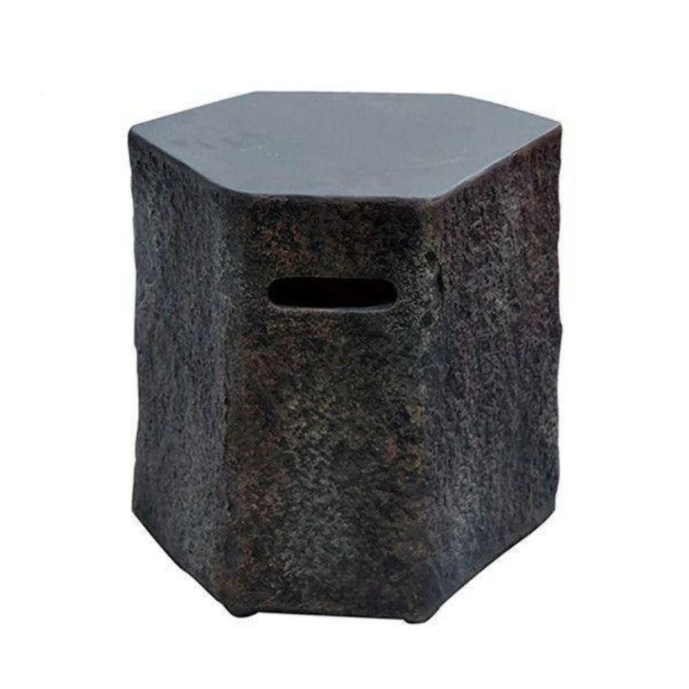 Hexagonal stone side table with a dark textured finish and a horizontal slot cutout on the front, shown against a plain white background.