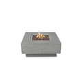 A square concrete fire pit with a lit flame, filled with dark decorative stones, shown against a solid white background.