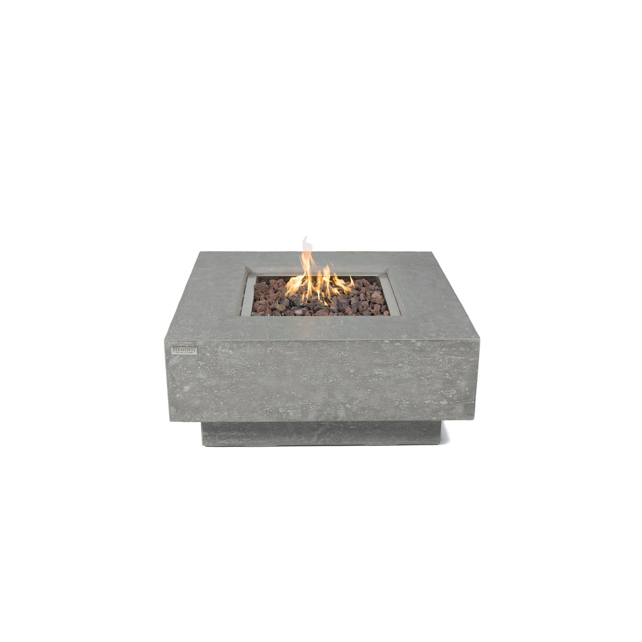 A square concrete fire pit with a lit flame, filled with dark decorative stones, shown against a solid white background.
