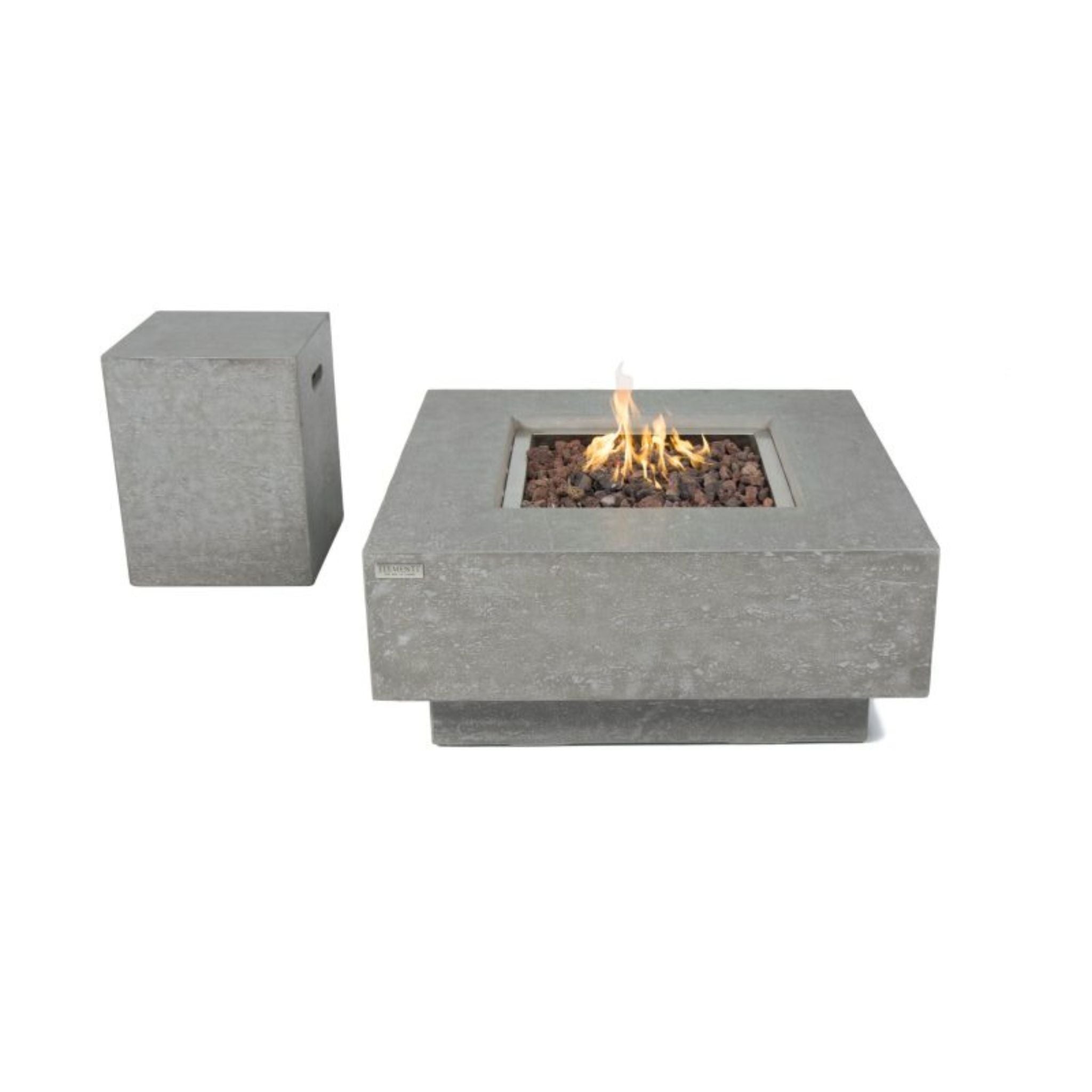 A square concrete fire pit table with a visible flame and dark stones inside, shown alongside a matching square side pedestal on a plain white background.