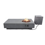 A rectangular concrete fire pit table with a circular fire bowl showing flames, paired with a matching cube-shaped outdoor speaker on a white background.