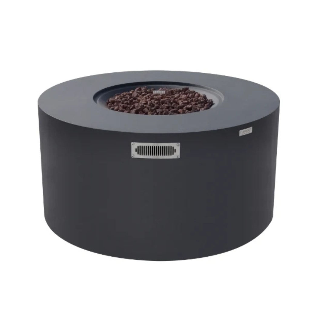 A round outdoor fire pit table with a dark charcoal gray metal body, a top fire bowl filled with dark brown embers, a front vent grille, and a small side label, shown on a plain white background.