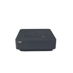 A dark gray rectangular electronic device with a flat top surface, photographed from a front angle on a plain white background. The brand name 'KEMPER' is visible on the top surface.
