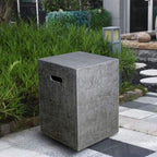 Concrete trash bin in a garden setting with greenery and a stone pathway.