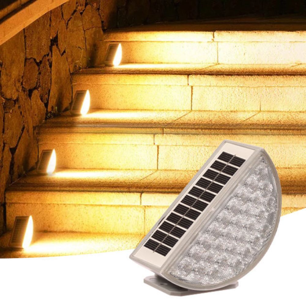 Solar-powered outdoor light fixture illuminating stone steps.