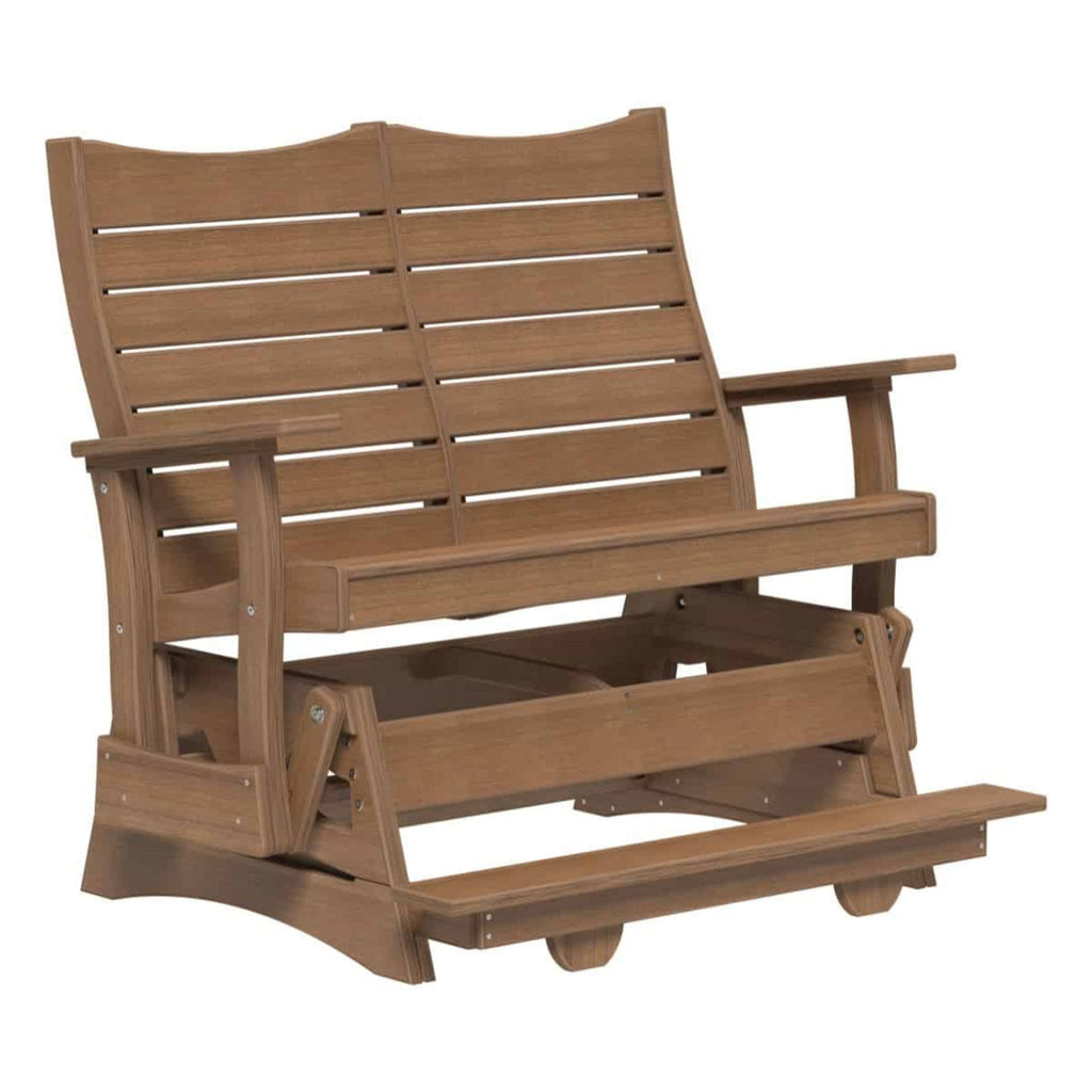 A brown wooden outdoor glider chair with a slatted backrest, armrests, and a footrest, shown on a plain white background.