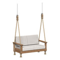 Wooden swing with white cushions on a white background
