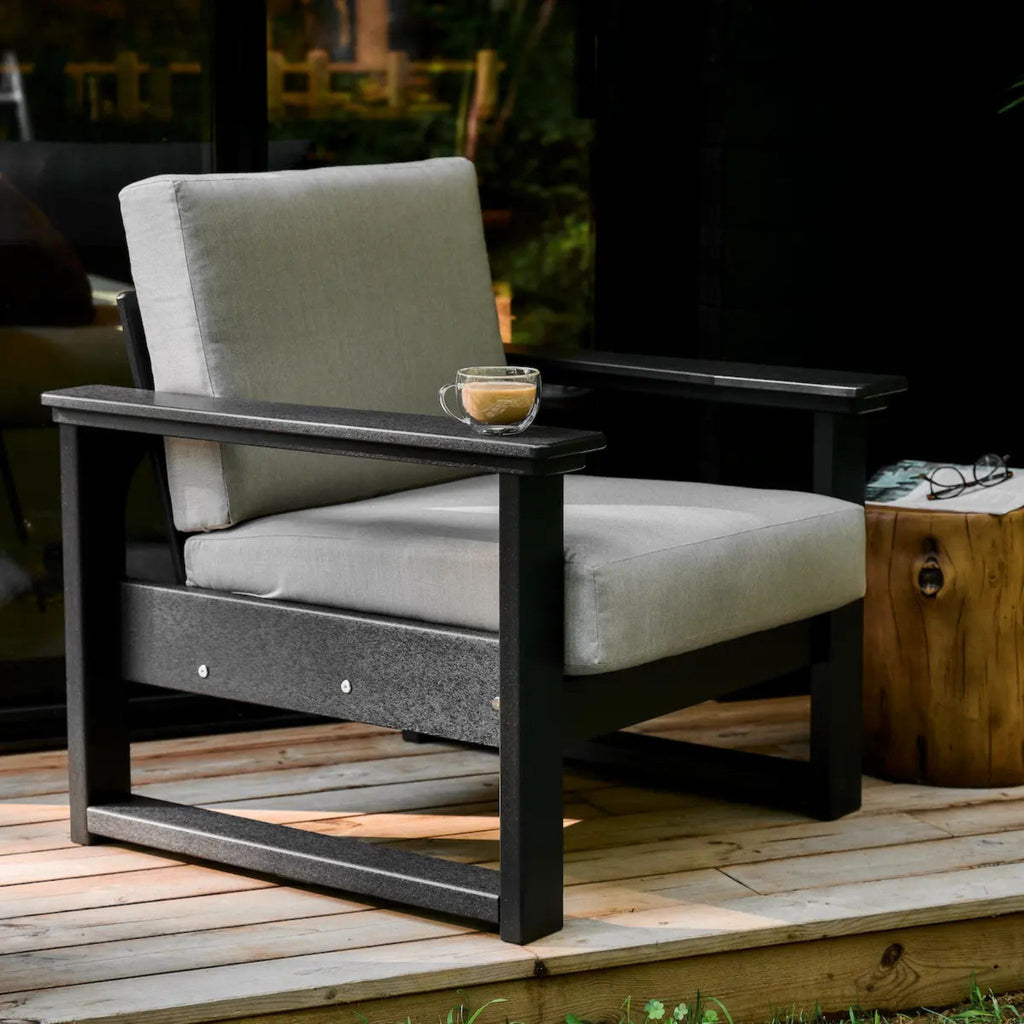 Outdoor chair with gray cushions on a wooden deck