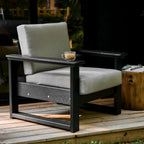 Outdoor chair with gray cushions on a wooden deck
