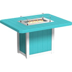 A turquoise and white outdoor fire pit table with a square tabletop, a built-in firebox with visible flames, and a clear glass wind guard, shown on a plain white background.