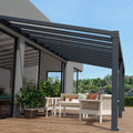 Outdoor patio with pergola, furniture, and plants on a wooden deck.