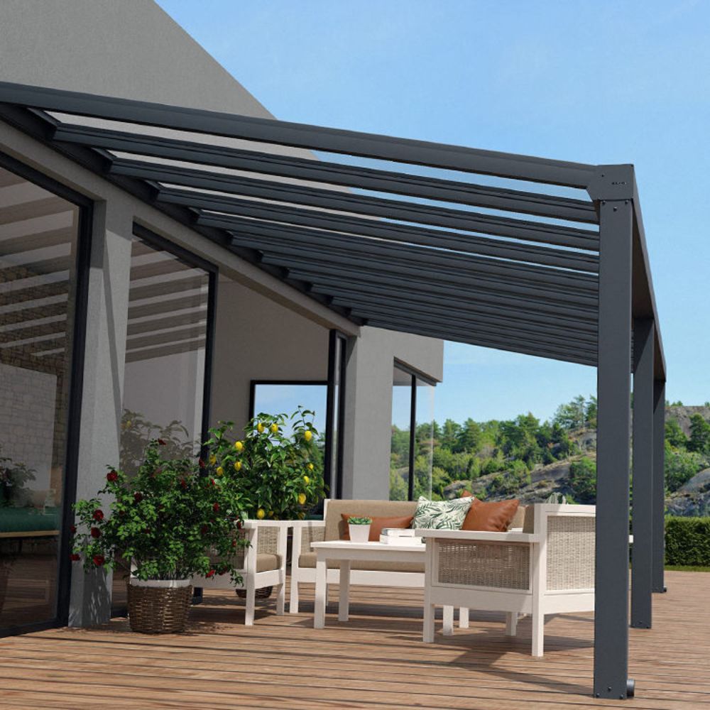 Outdoor patio with pergola, furniture, and plants on a wooden deck.