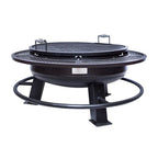 Black metal fire pit with grill top on a white background