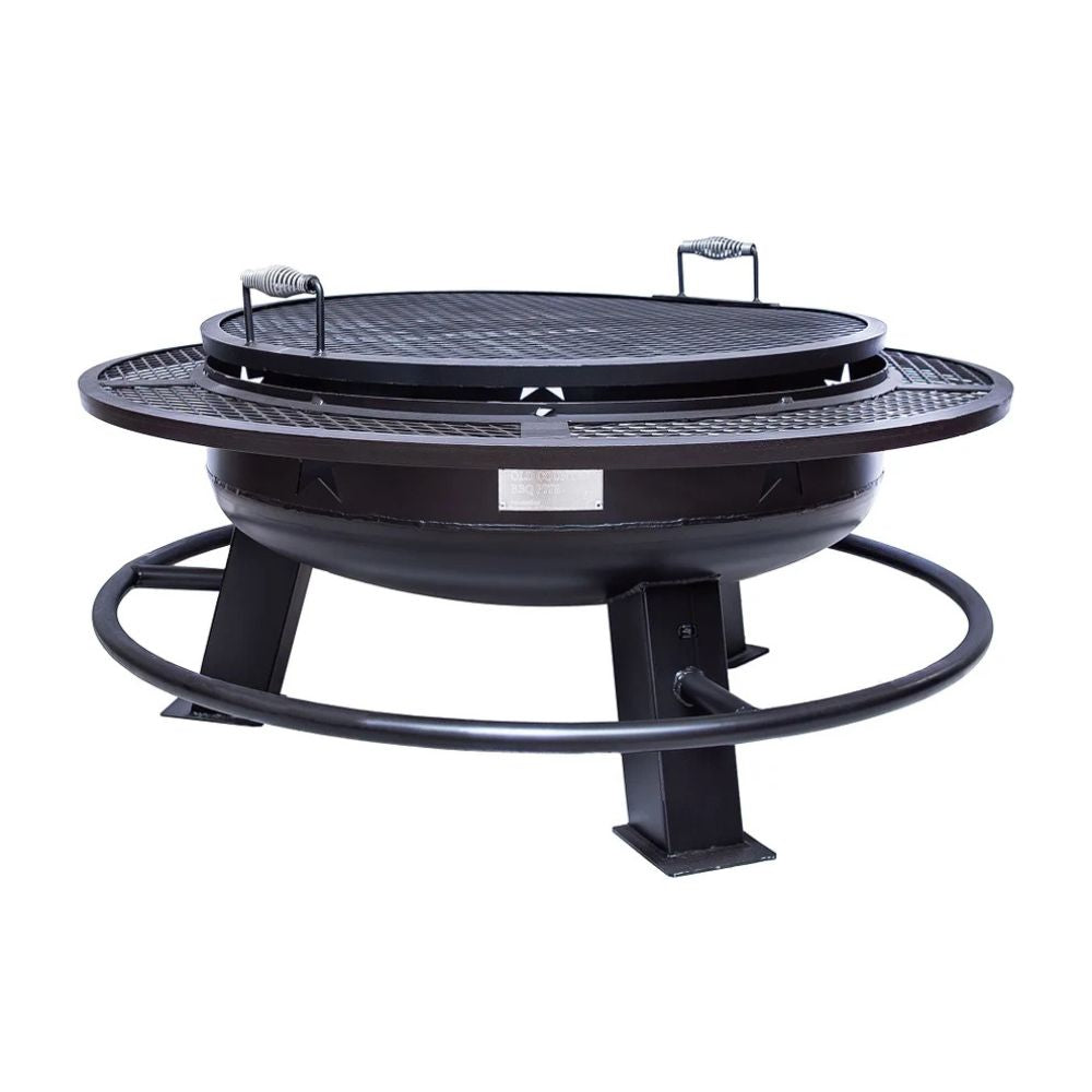 Black metal fire pit with grill top on a white background