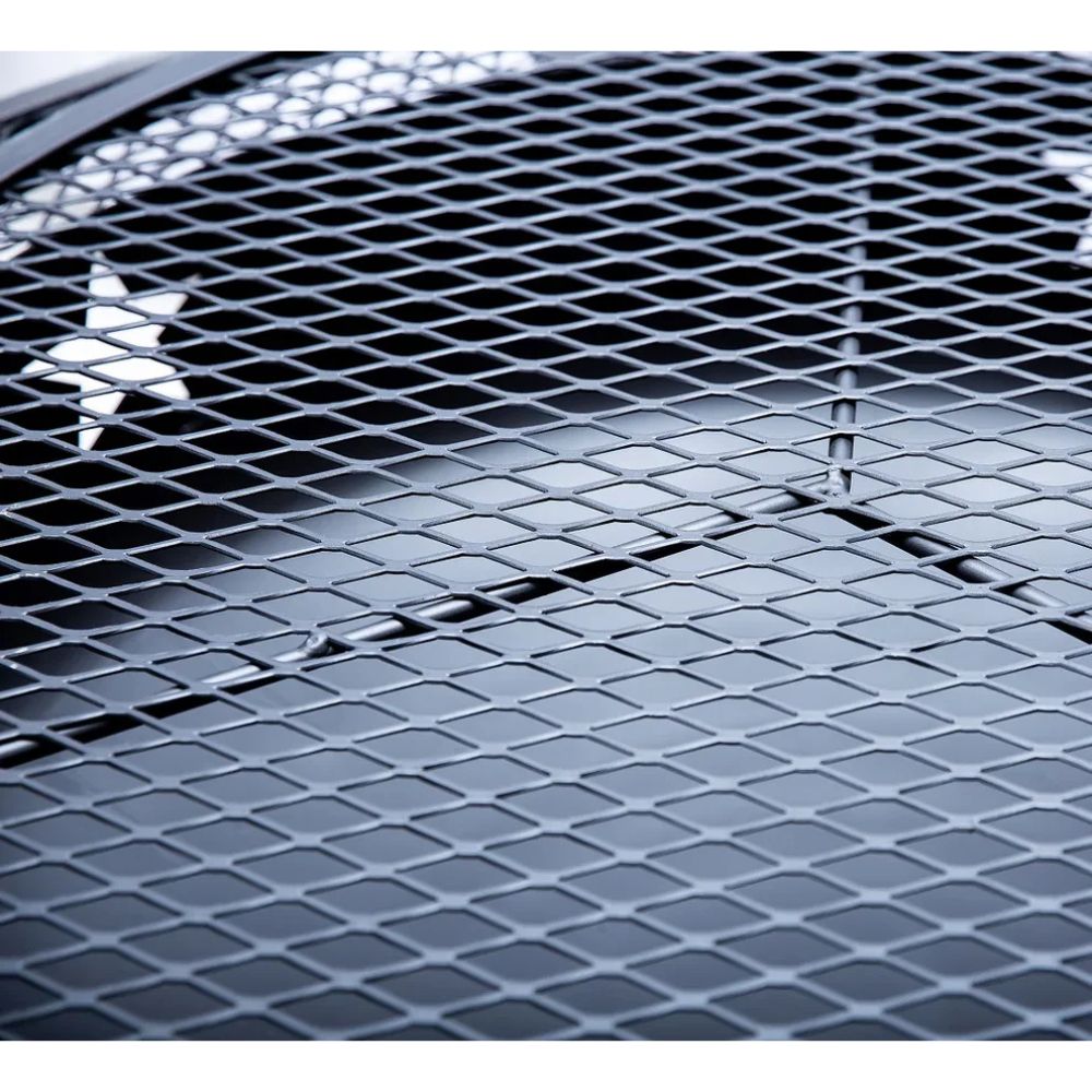 Close-up of a car grille with a diamond pattern