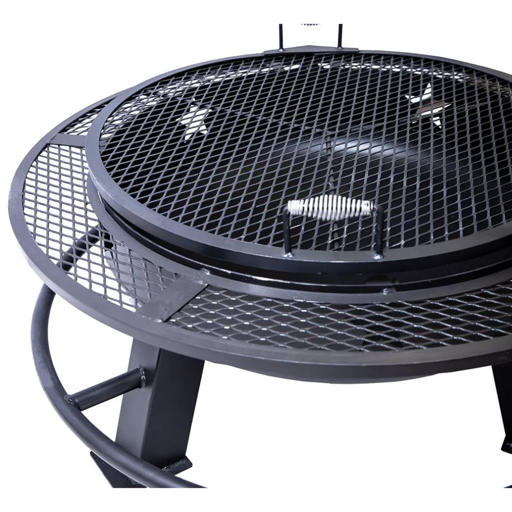 Black metal fire pit with mesh design on a white background