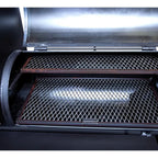 Close-up of a grill with open lid showing grates inside