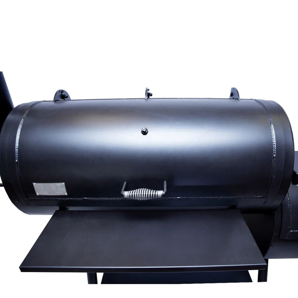 Black cylindrical barbecue grill on a white background