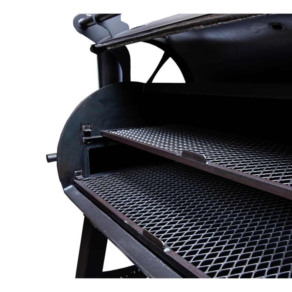 Close-up of a black barbecue grill with open lid on a white background