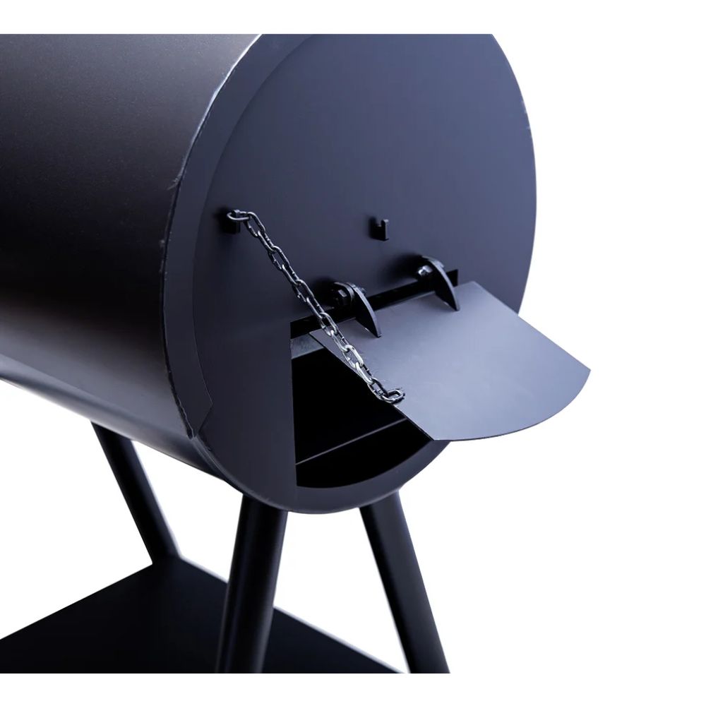 Close-up of a black barbecue grill with a chain on a white background