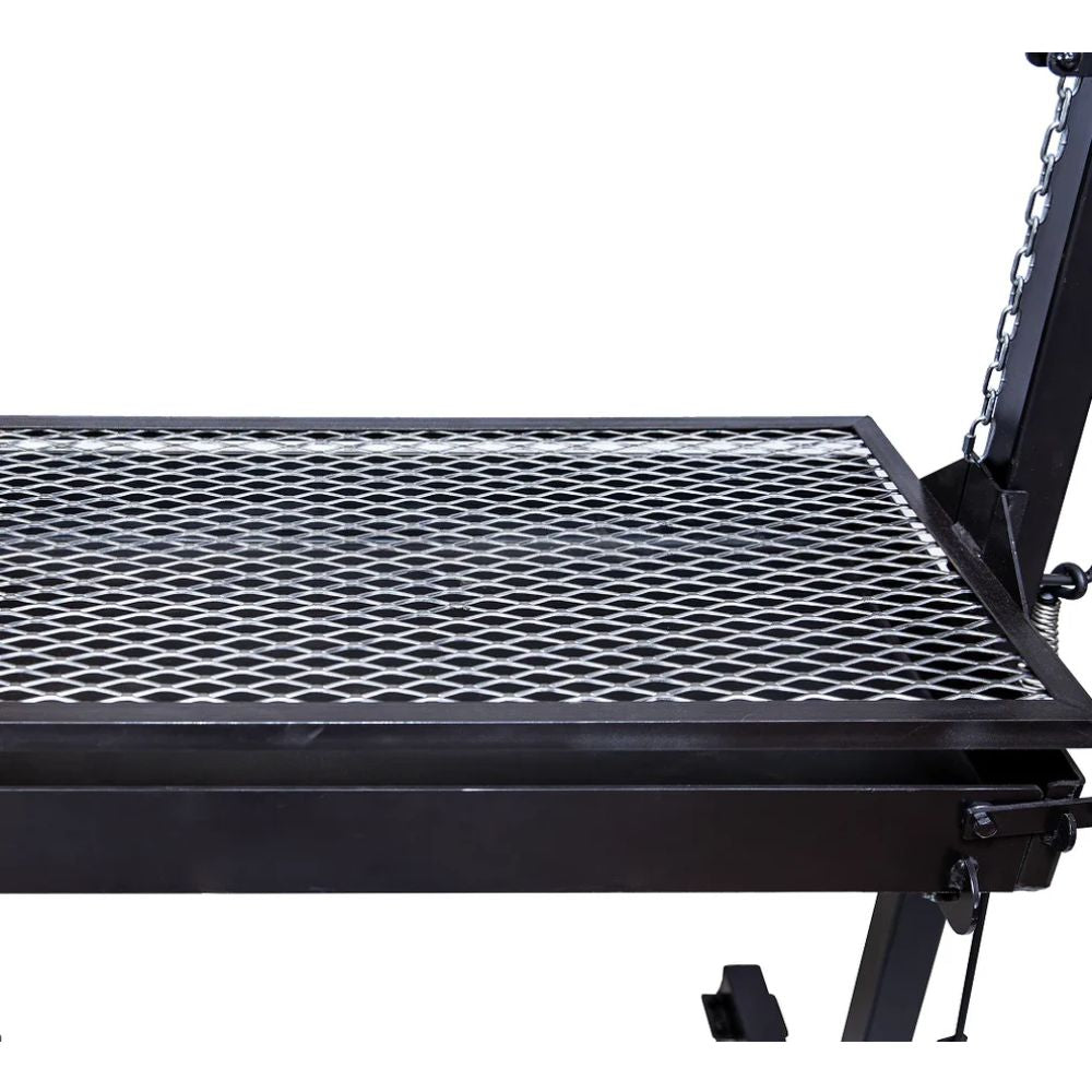 Black metal grill with diamond-patterned surface on a white background