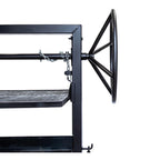 Black metal shelf with a wheel on a white background