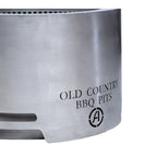 Metallic surface with 'Old Country BBQ Pits' branding on a white background
