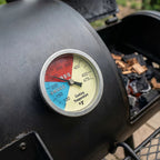 Barbecue grill with a thermometer showing temperature settings
