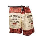 Two bags of Old Country Lump Charcoal Oak on a white background