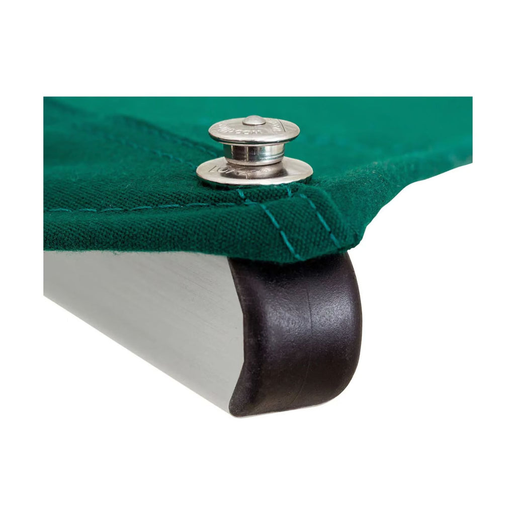 Close-up of a green fabric canopy or tarp corner attached to a silver metal support with a black rubber grommet, on a white background.