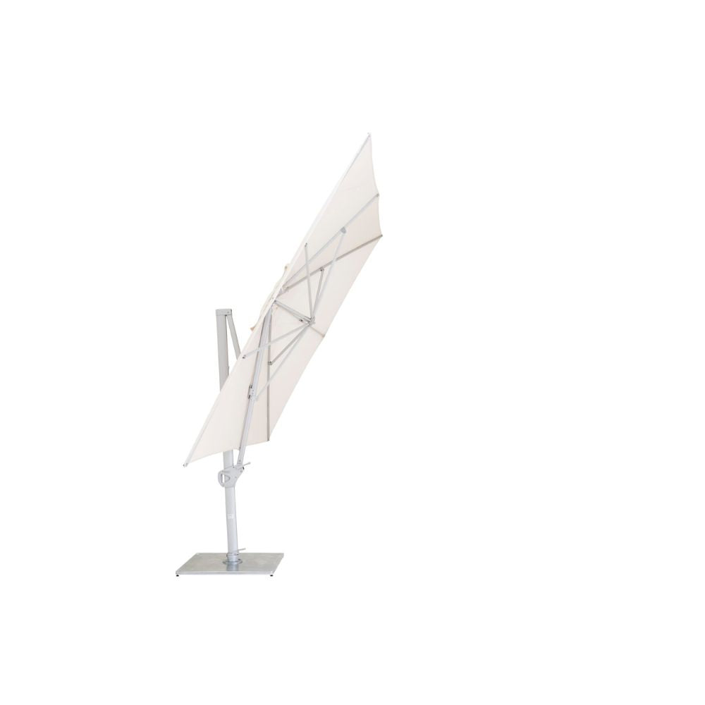 A cantilever-style patio umbrella with a light beige canopy and a silver metal frame and base, shown on a plain white background.
