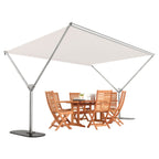 A square cantilever patio umbrella with a beige canopy and silver metal frame, shown with a wooden dining table and four matching chairs underneath on a white background.