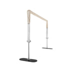A silver metal frame support stand with a beige fabric sleeve wrapped around the top section and a black oval base, shown on a plain white background.